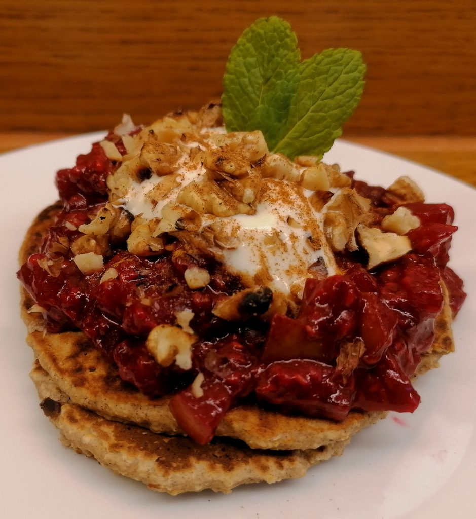 Oat pancakes with raspberry & pear compote and toasted walnuts