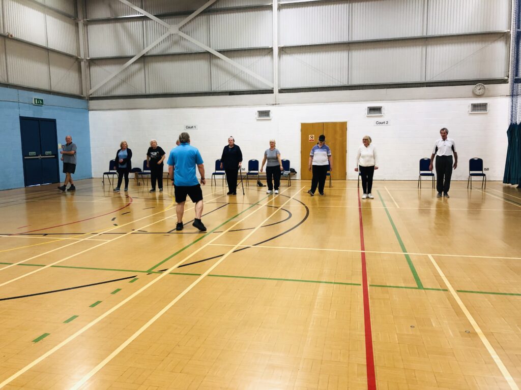 Charnwood Family group exercising in indoor hall