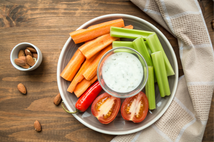 3 plate of vegetables and a dip