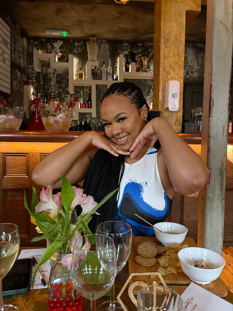 Omobolaji Okenla posing in restaurant smiling
