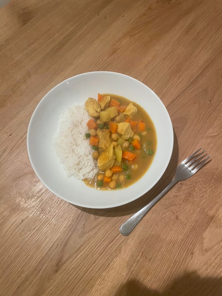 a bowl of curry and white rice
