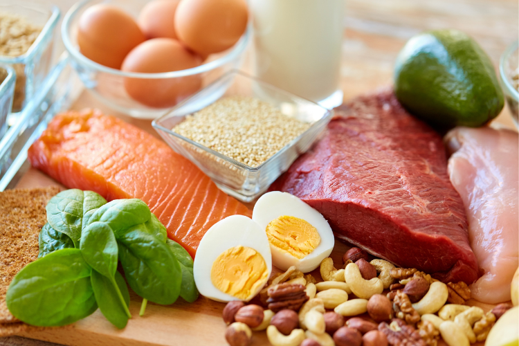 healthy weight 3 counter displaying eggs, sesame seeds, spinach, avocado, nuts, raw salmon and raw meet