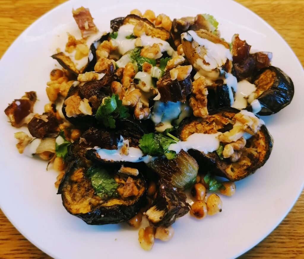 Cumin-roasted aubergine with walnuts, chickpeas & dates