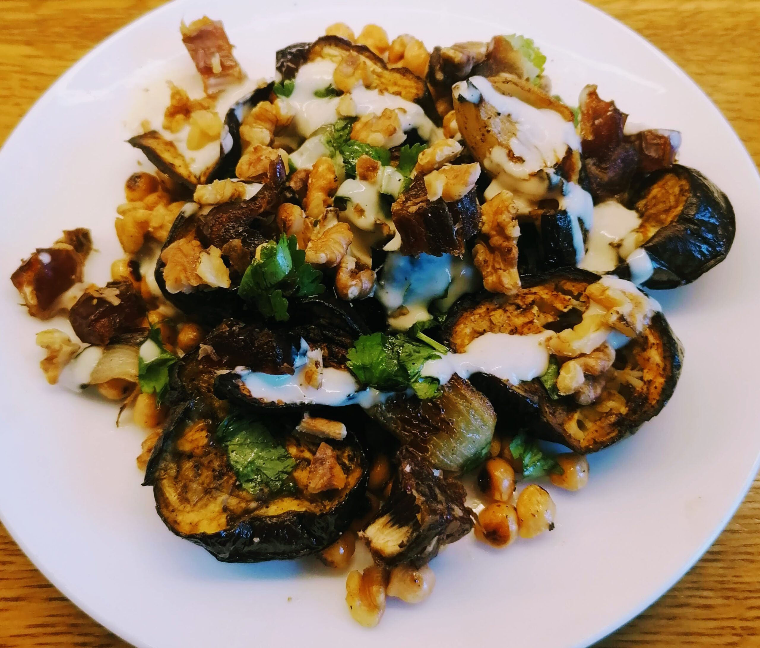 Cumin-roasted aubergine with walnuts, chickpeas & dates