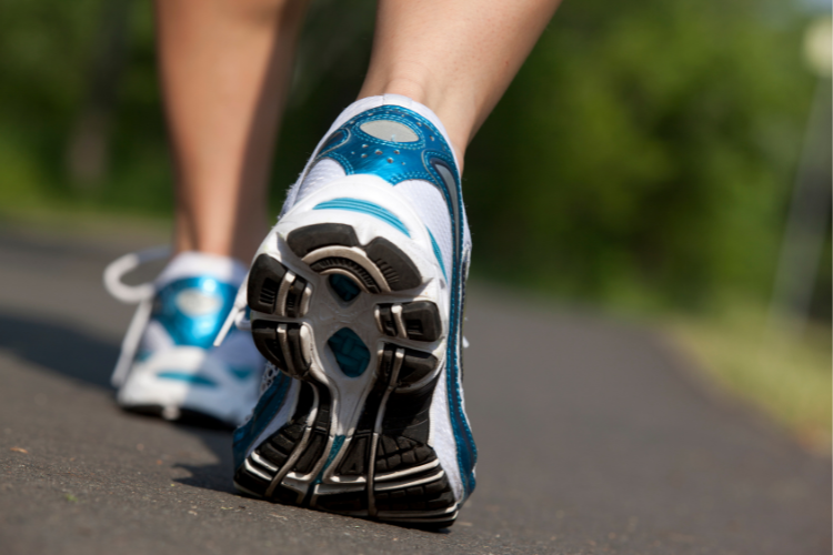 feet-in-trainers-walking-on-road