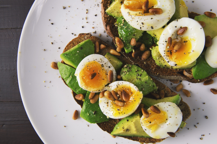Open sandwich with avocado and boiled eggs