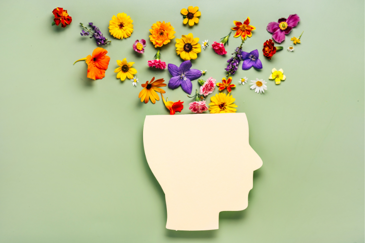 a graphic of a head with flowers emerging from the head