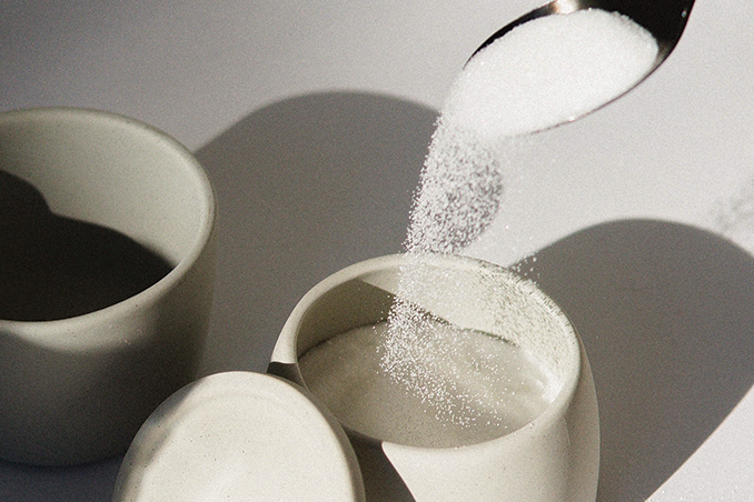 spoonful of sugar being poured