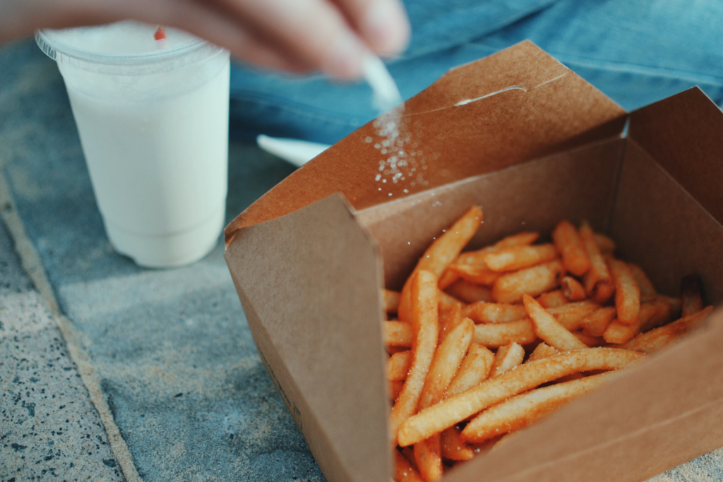 salt being poured on chips