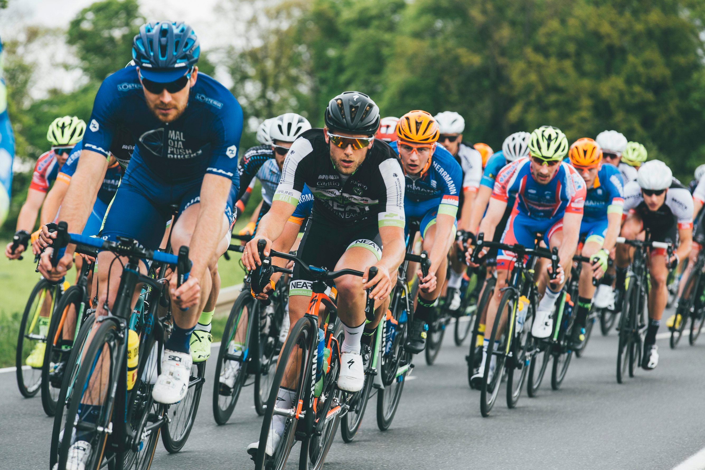 pic 4 A group of cyclists riding together.