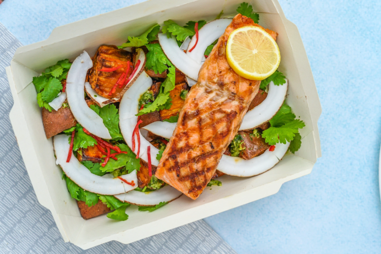 Lunchbox pic 1 Salmon laying on salad in a lunch box