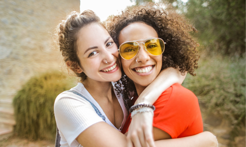 stress pic 3 two girls embracing and smiling towards the camera