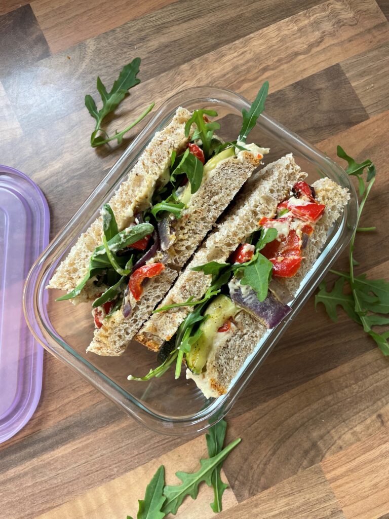 This roasted vegetable and hummus sandwich is a delicious and nutritious way to pack in your daily servings of vegetables.